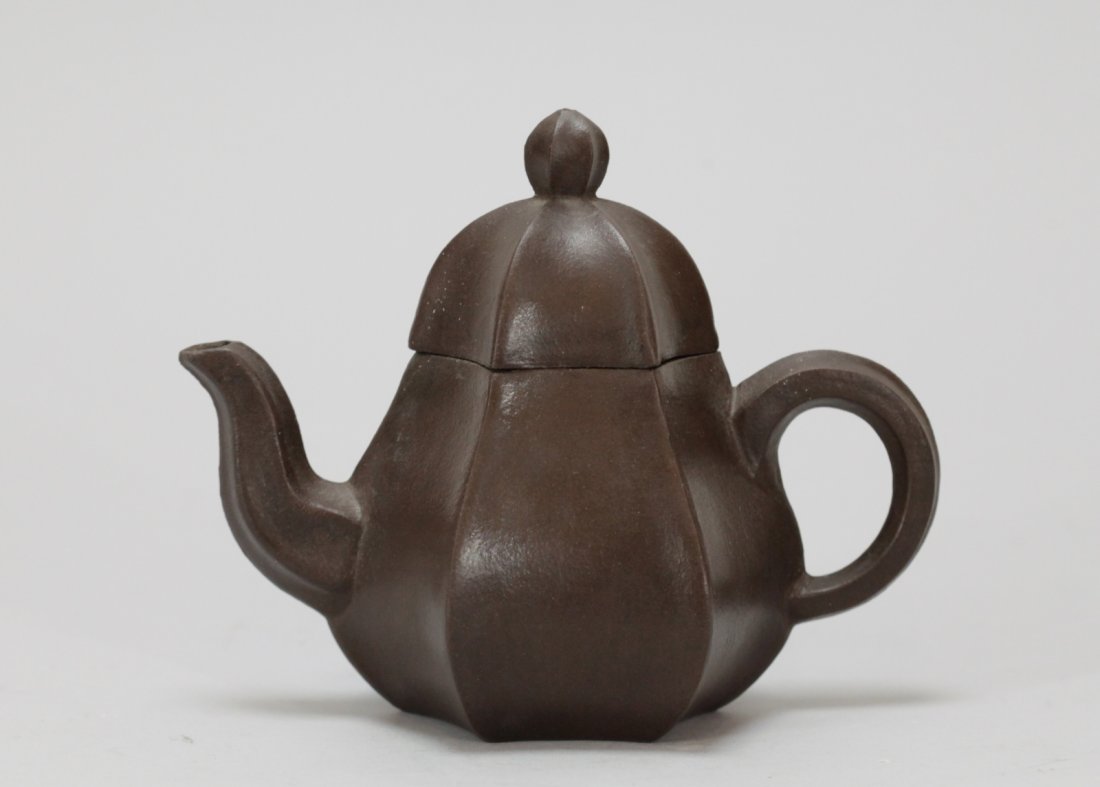 Chinese Zisha Carved Teapot: Chinese Zisha Carved Teapot Condition: good Dimension: 5 1/4 inches height by 6 3/4 inches width