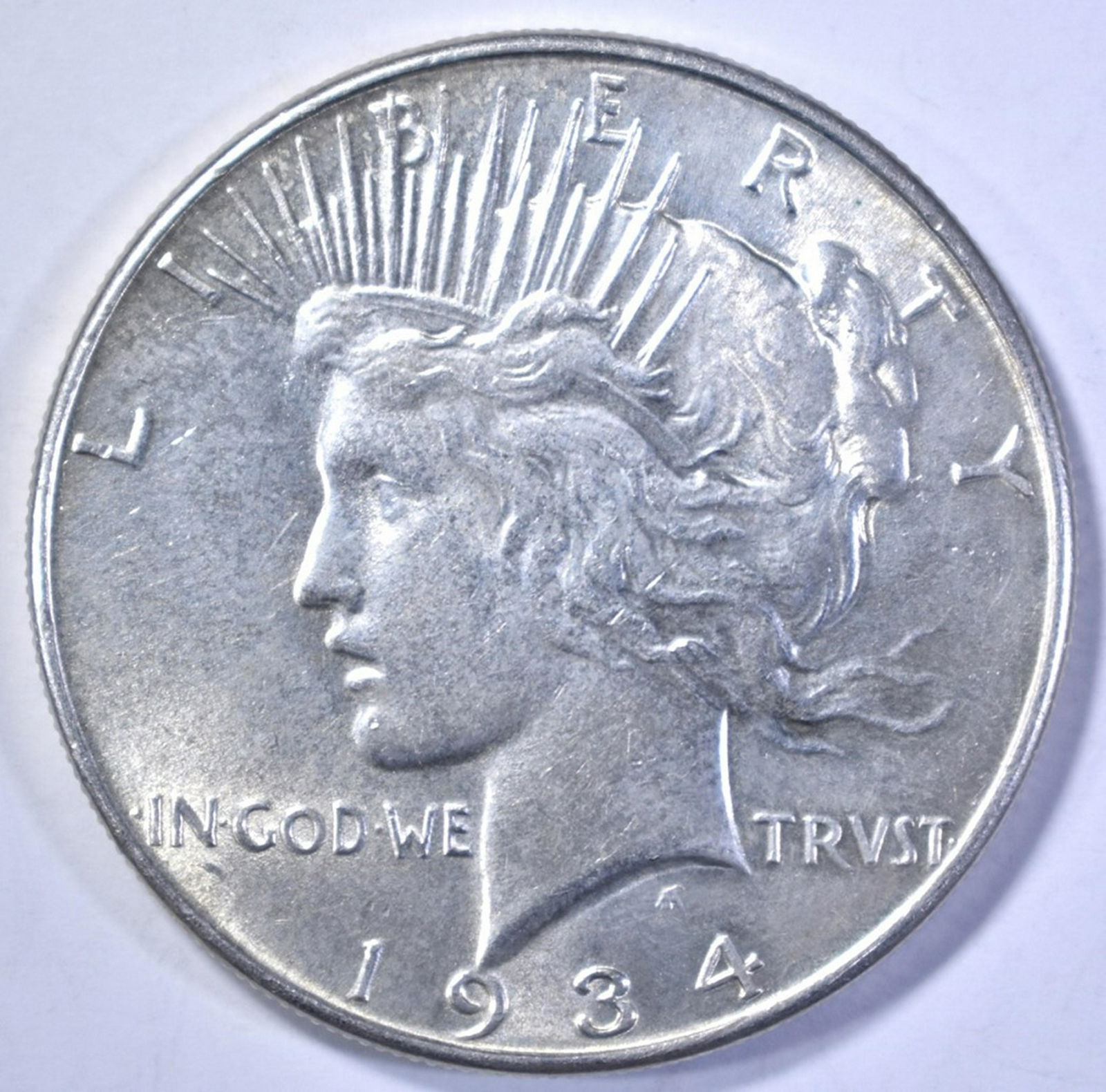 1934 PEACE DOLLAR, NICE BU: CHECK OUT OUR UPCOMING ONLINE COIN AUCTIONS ESTIMATE $140 - $160.