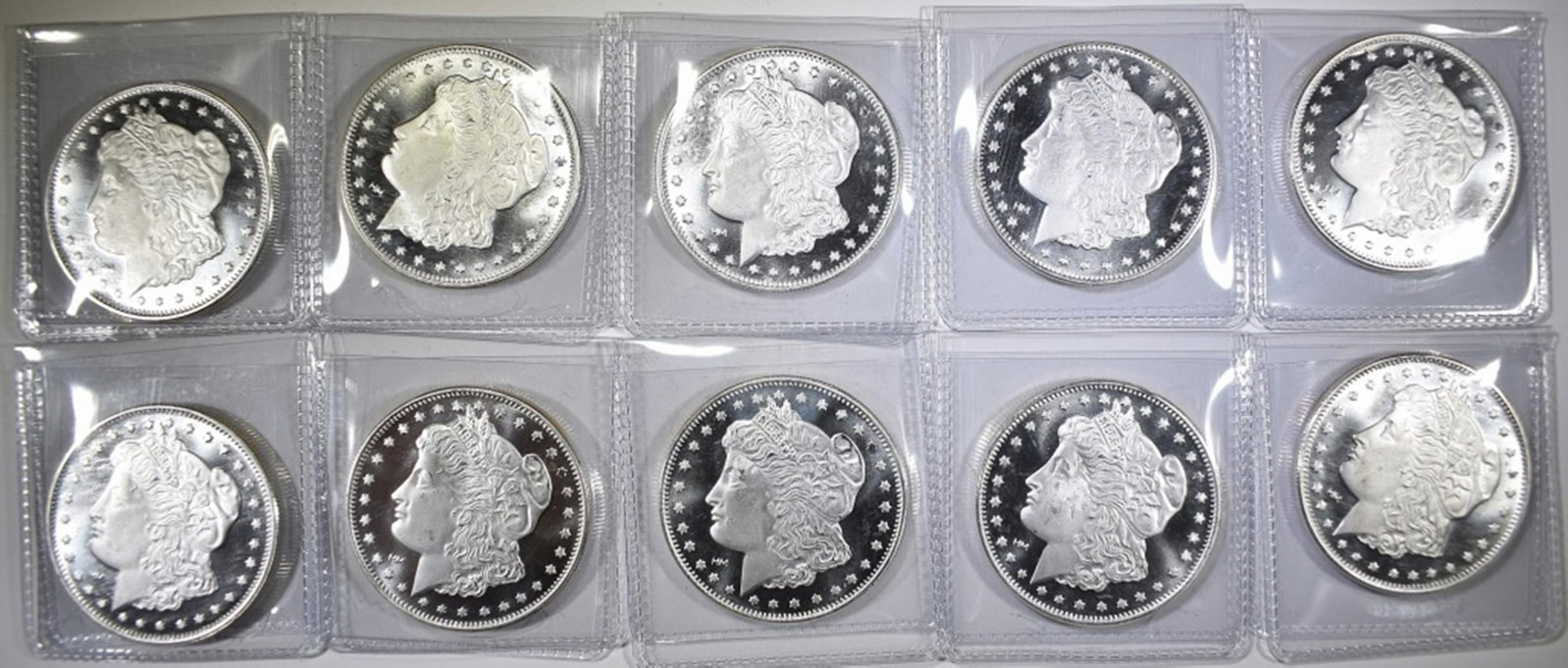 10-MORGAN REPLICA ONE OUNCE SILVER ROUNDS: IN INDIVIDUAL COIN FLIPS ESTIMATE $210 - $240.