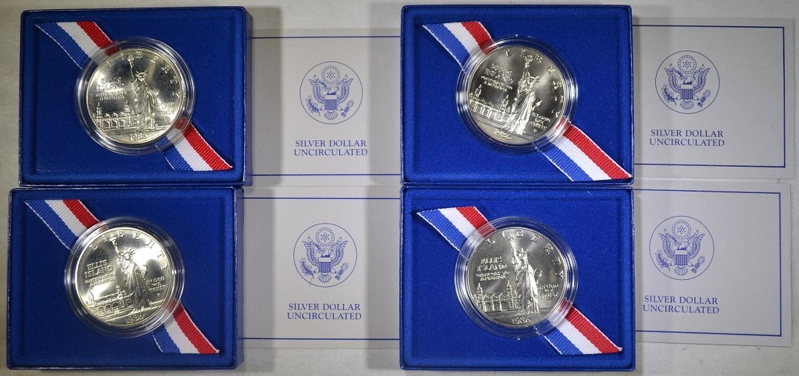 4-1986 UNC STATUE OFLIBERTY COMMEM SILVER DOLLARS: ORIGINAL PACKAGING ESTIMATE $90 - $100.