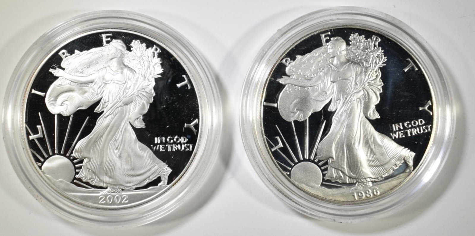 1986-S & 2002-W PROOF AMERICAN SILVER EAGLES: TOP RATED AUCTION HOUSE ESTIMATE $75 - $100.