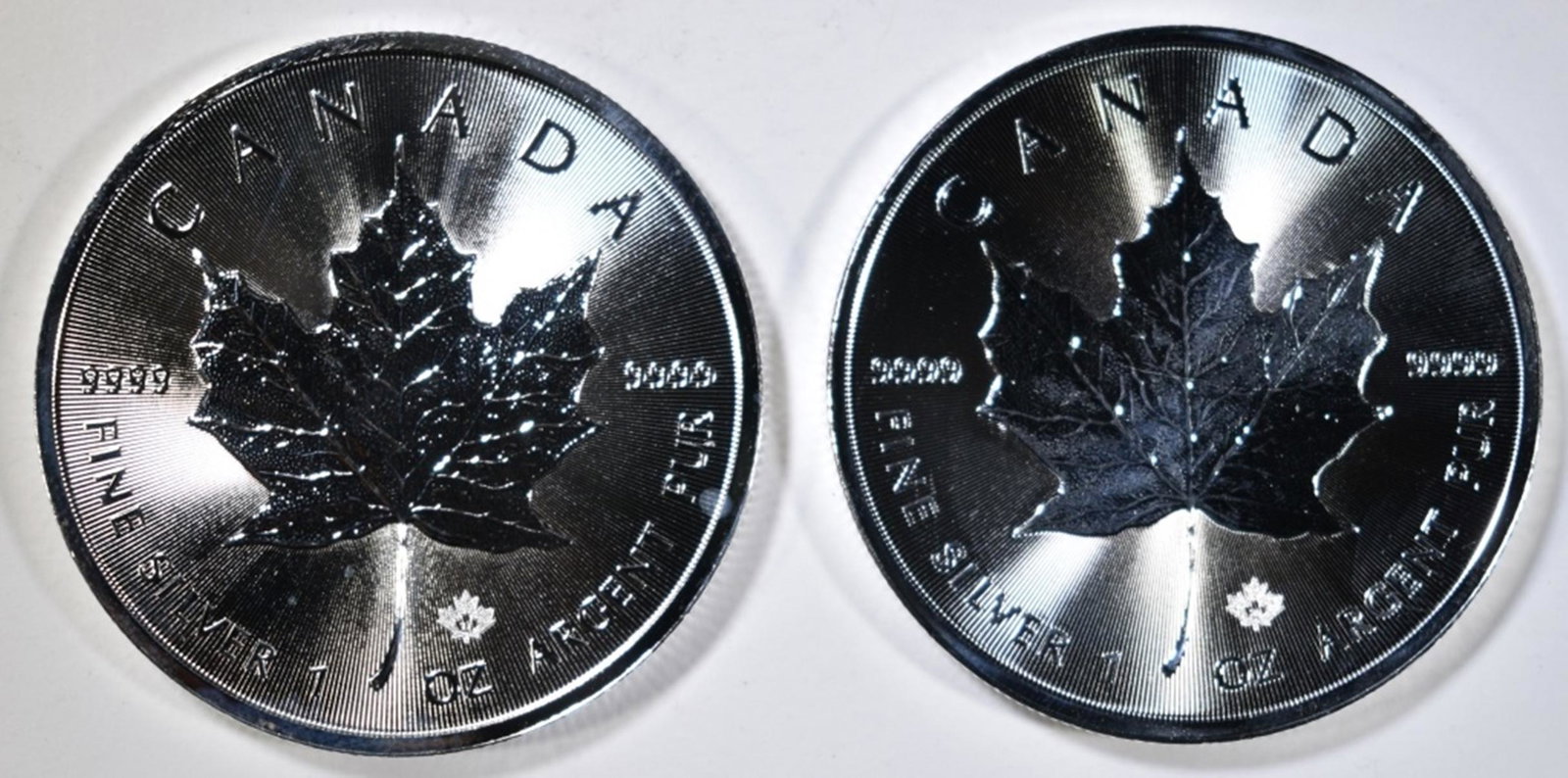 2017 & 2020 1-OUNCE SILVER CANADA MAPLE LEAF COINS: CHECK OUT OUR UPCOMING AUCTIONS ESTIMATE $75 - $85.