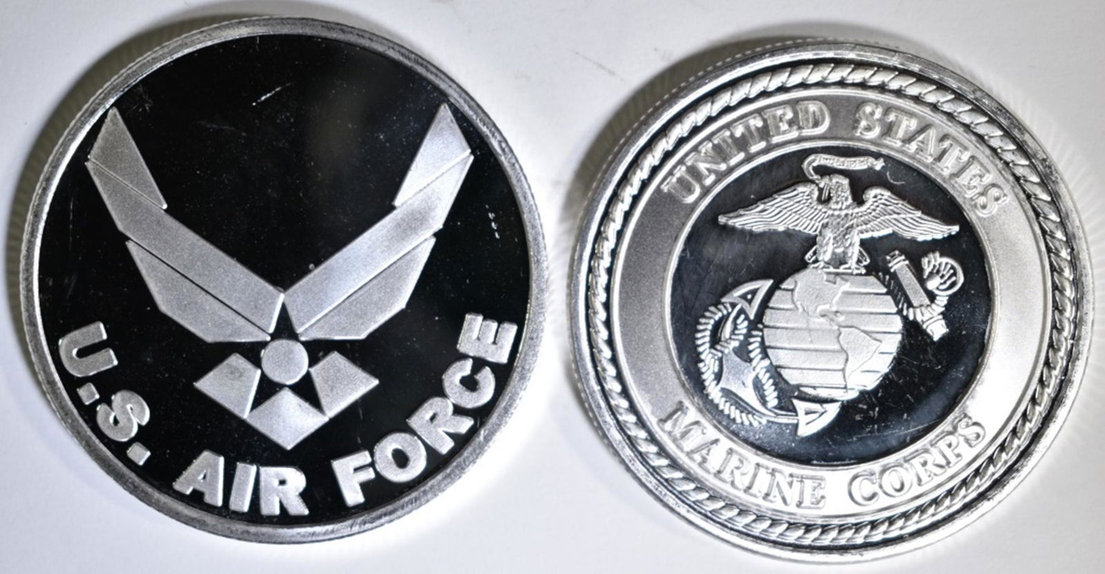 AIR FORCE & MARINES ONE OUNCE .999 SILVER: LEADERS IN ON-LINE AUCTIONS ESTIMATE $75 - $85.