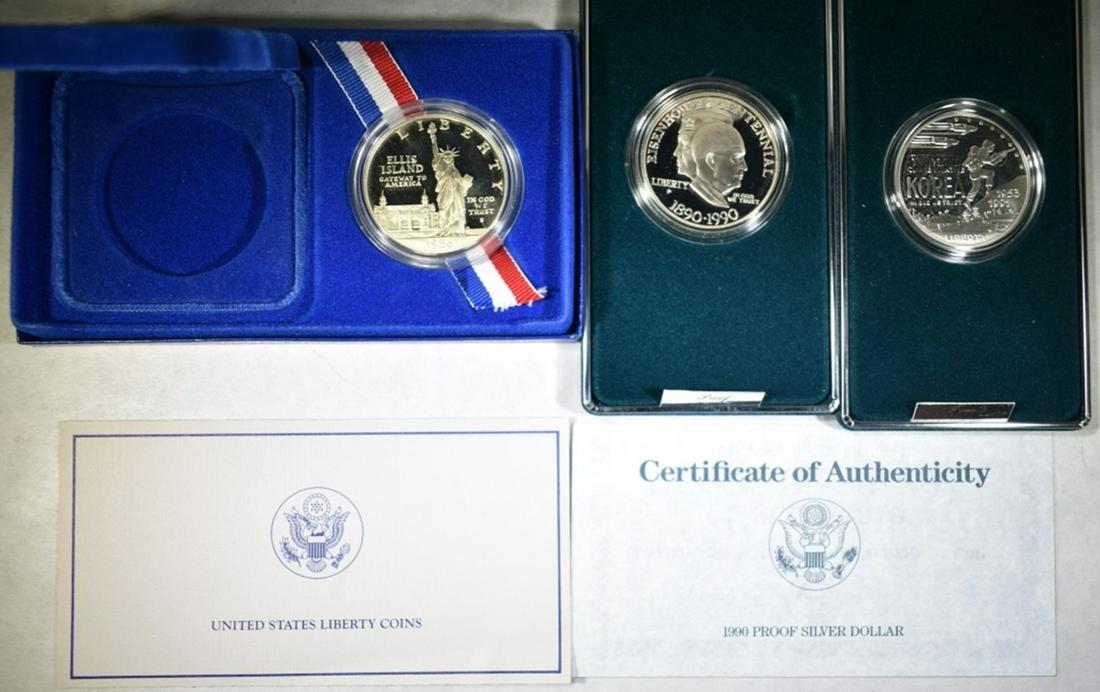 MODERN COMMEM SILVER DOLLAR LOT:: 1991 PROOF KOREA, 1990 IKE & 1986 PROOF LIBERTY. KOREA MISSING CERT. ESTIMATE $90 - $110.