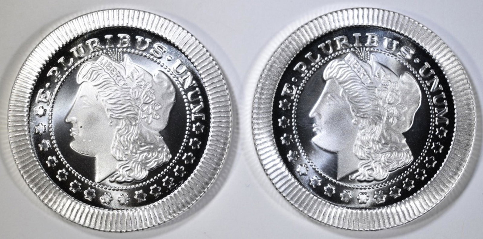 2-ONE OUNCE .999 SILVER ROUNDS STACKABLE MORGAN: LEADERS IN ON-LINE AUCTIONS ESTIMATE $85 - $95.