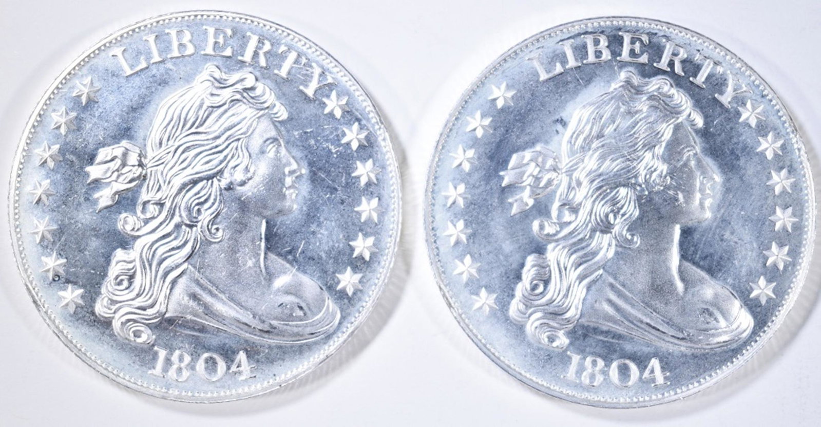 2-1804 DOLLAR REPLICA ONE OUNCE SILVER ROUNDS: WEEKLY COIN & CURRENCY AUCTIONS ESTIMATE $80 - $90.
