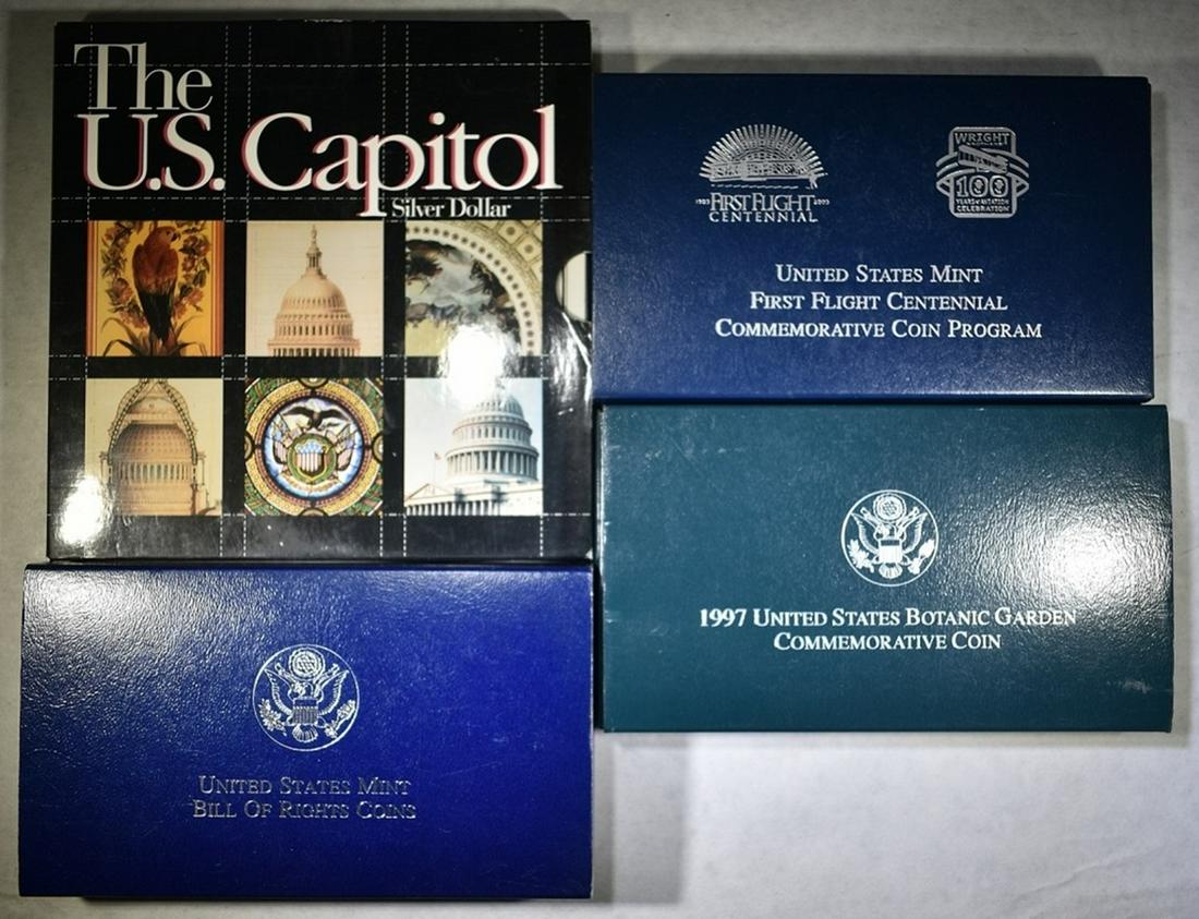 LOT OF 4 PROOF COMMEM DOLLARS:: 1993 2-COIN BILL OF RIGHTS, 1994 US CAPITOL, 1997 BOTANIC GARDEN & 2003 FIRST FLIGHT. ESTIMATE $120 - $140.