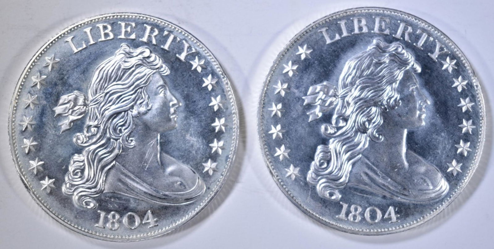 2-1804 REPLICA DOLLAR ONE OUNCE SILVER ROUNDS: BID WITH SILVER CITY AUCTIONS ESTIMATE $80 - $90.