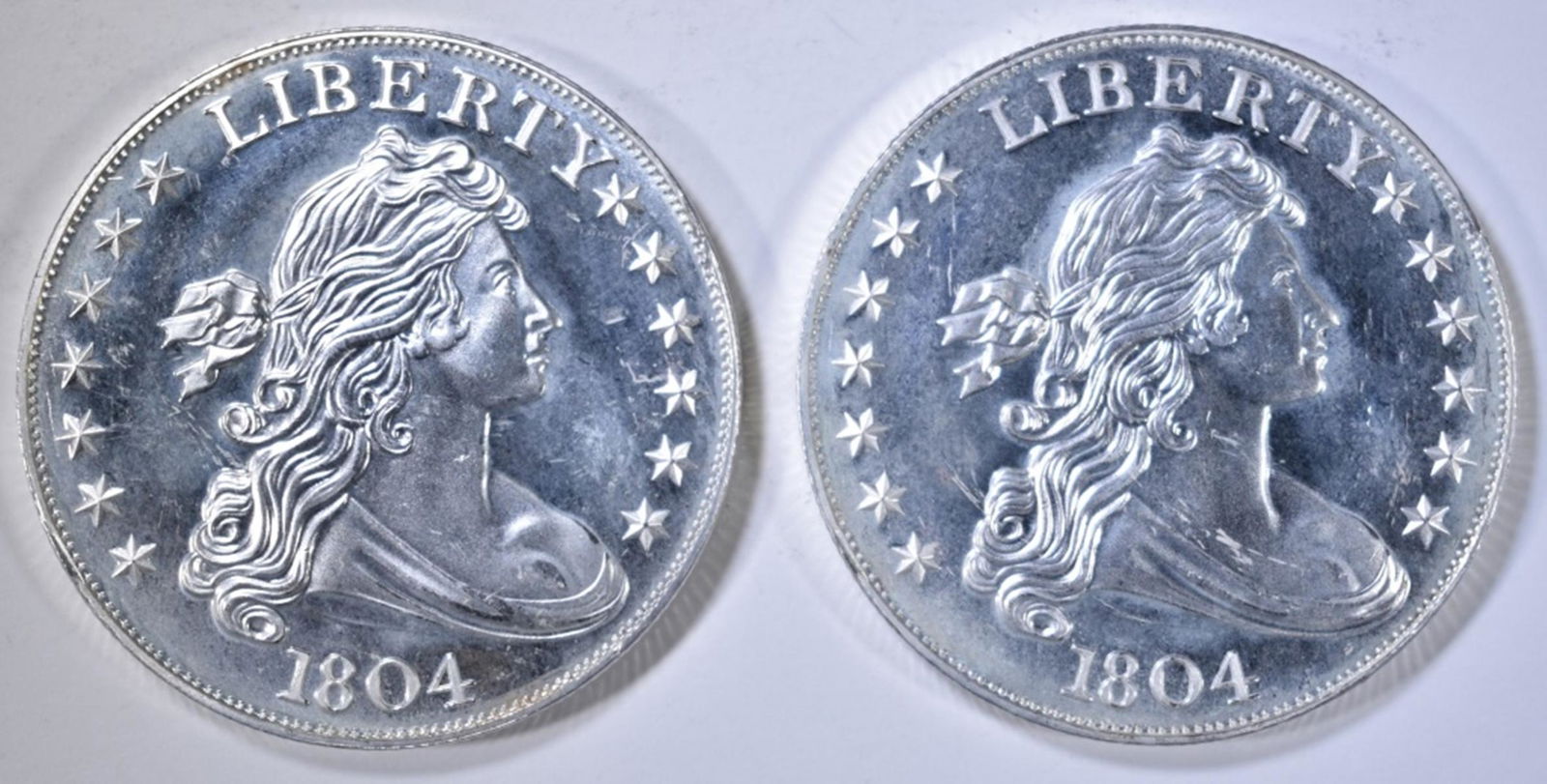 2-1804 DOLLAR REPLICA ONE OUNCE SILVER ROUNDS: WEEKLY COIN & CURRENCY AUCTIONS ESTIMATE $80 - $90.