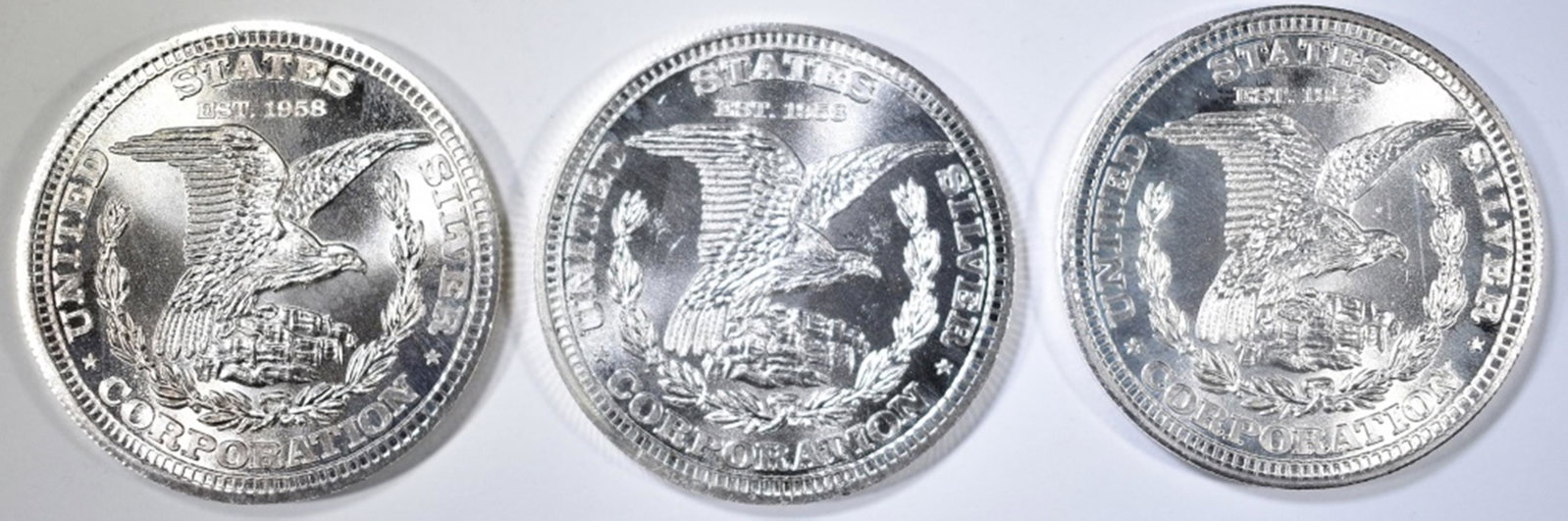 3 1 TROY OUNCE SILVER ROUNDS: TOP RATED AUCTION HOUSE. ESTIMATE $90 - $110.