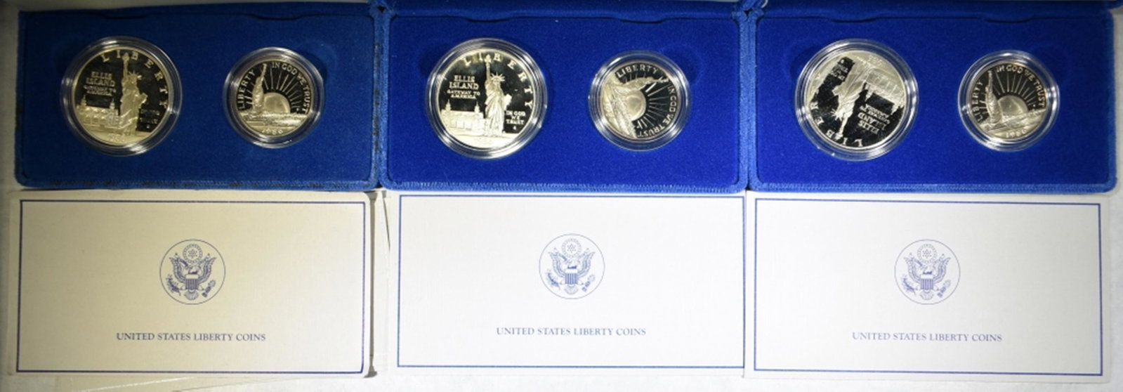 3-1986 2-PIECE PROOF STATUE OF LIBERTY COMMEM SETS: LEADERS IN ON-LINE AUCTIONS ESTIMATE $90 - $110.