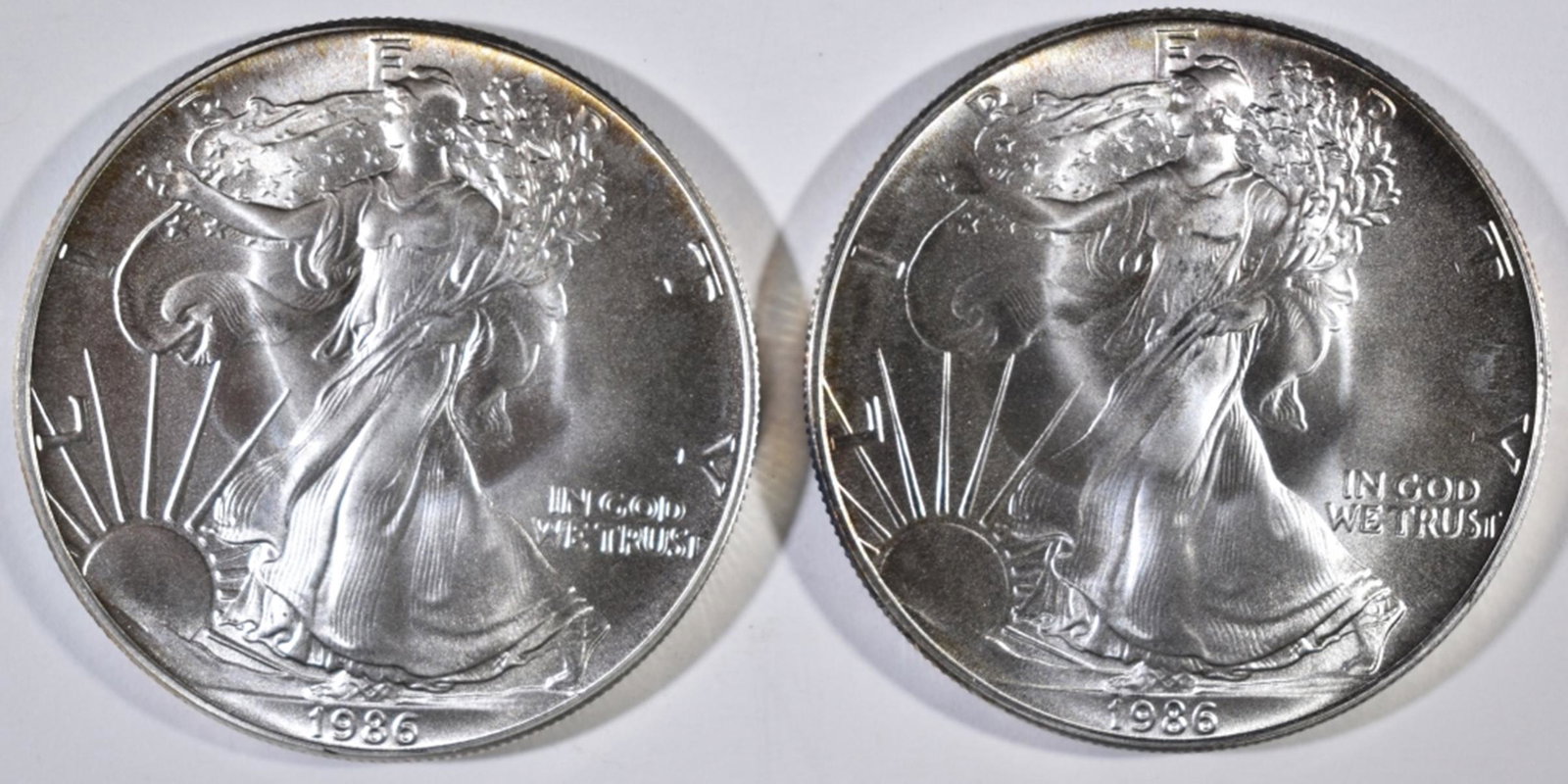 2-1986 BU AMERICAN SILVER EAGLES: BID WITH SILVER CITY AUCTIONS ESTIMATE $100 - $120.
