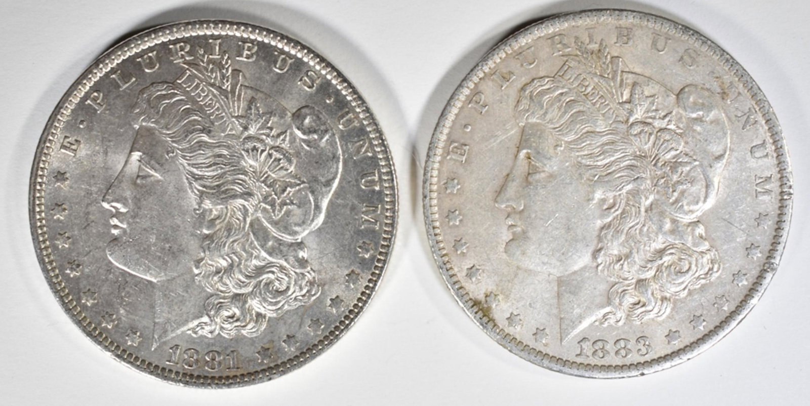 1881-O & 1883-O BU MORGAN DOLLARS: TOP RATED AUCTION HOUSE ESTIMATE $90 - $110.