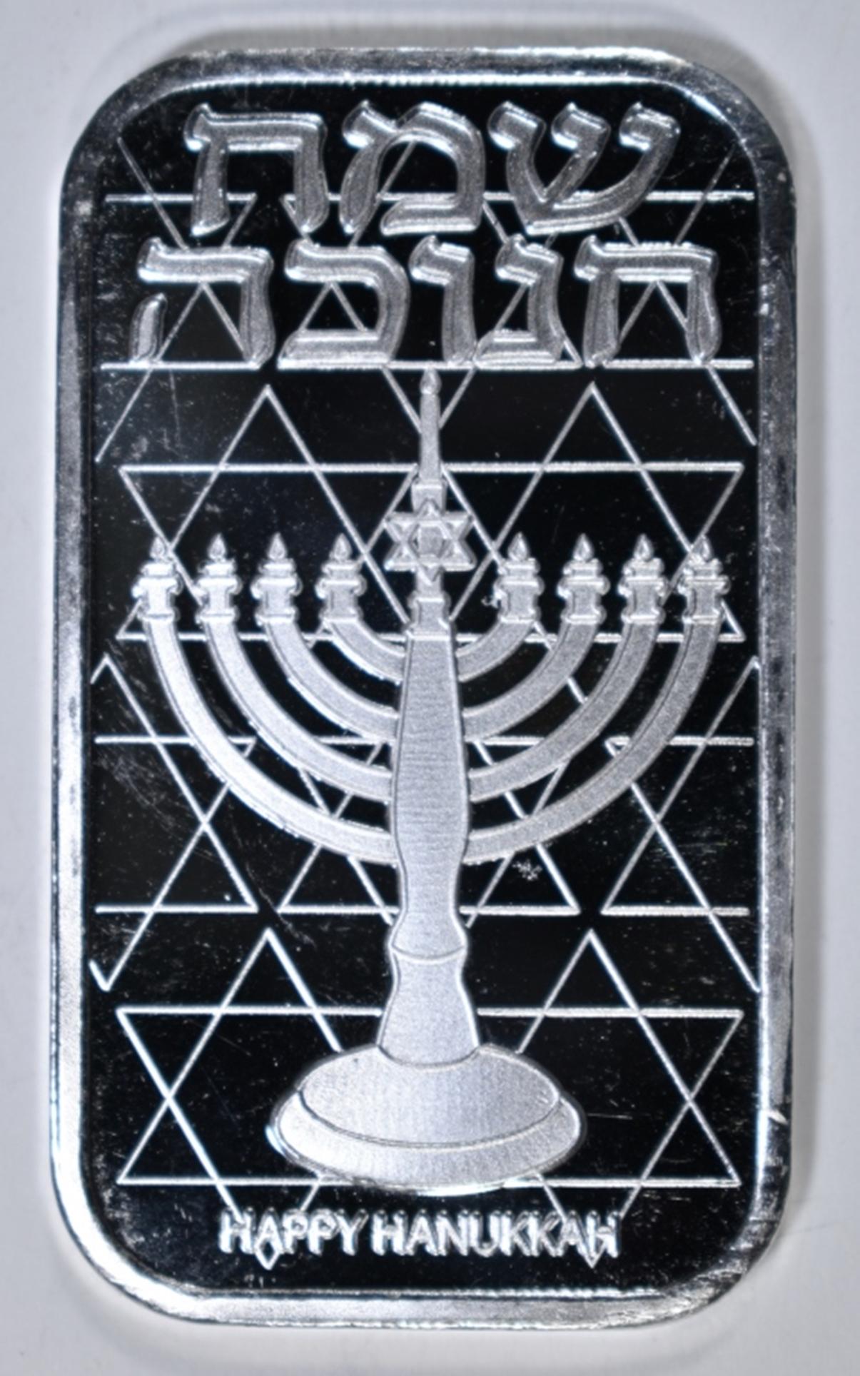 2020 HAPPY HANUKKAH 1oz .999 SILVER BAR: WEEKLY COIN & CURRENCY AUCTIONS ESTIMATE $55 - $65.