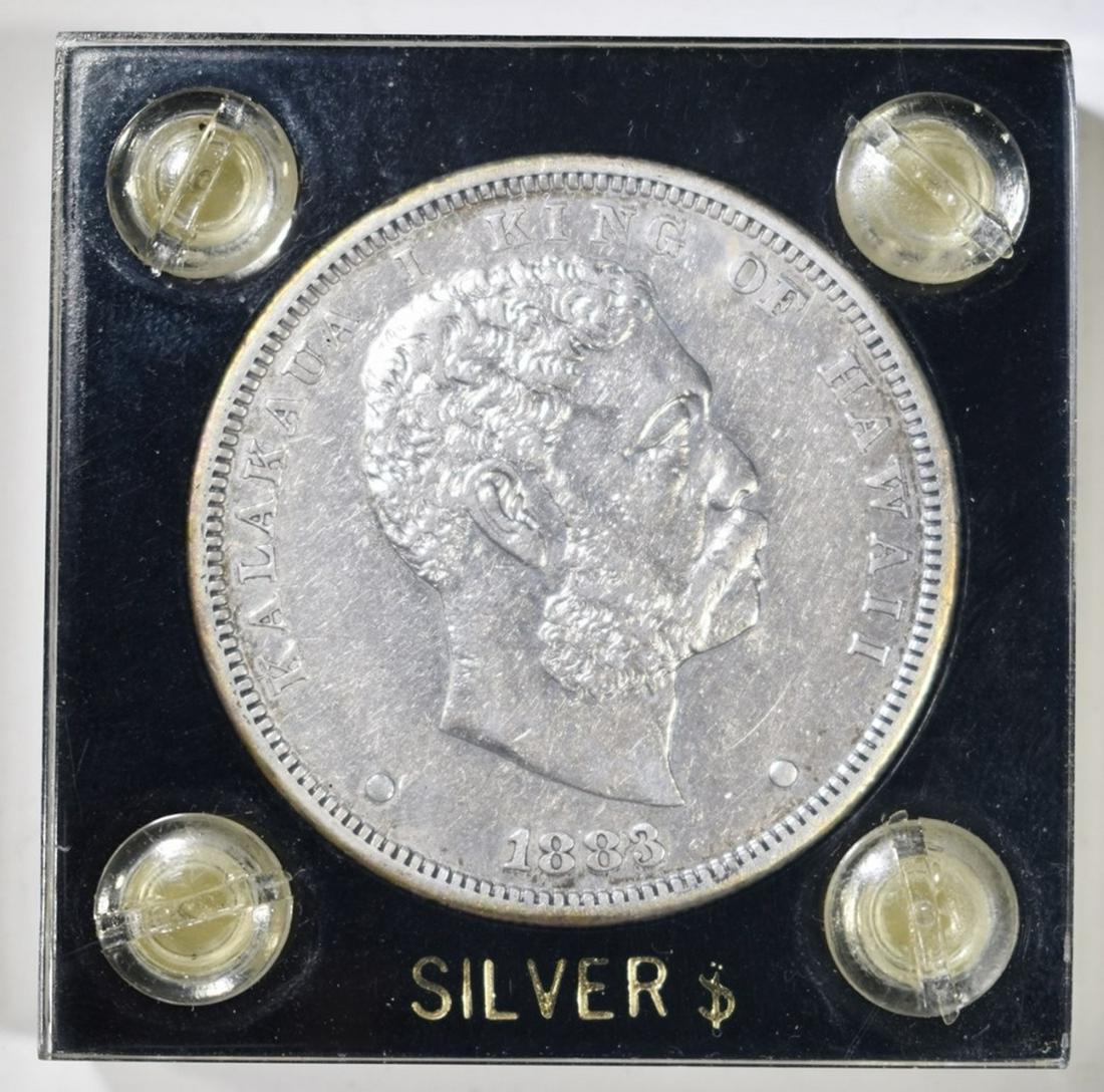 1883 HAWAII DOLLAR AU: BID WITH SILVER CITY AUCTIONS. ESTIMATE $900 - $1000.