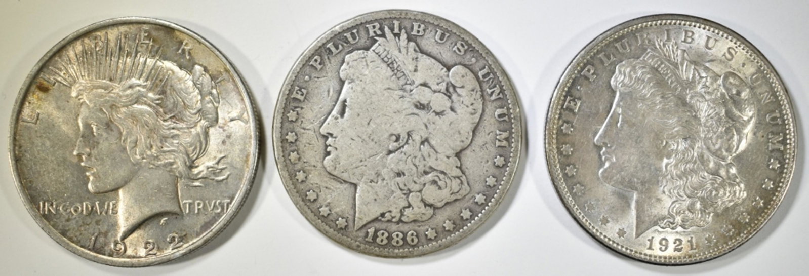 3-CIRC SILVER DOLLARS:: 1886, 1921 MORGAN & 1922 PEACE ESTIMATE $110 - $130.