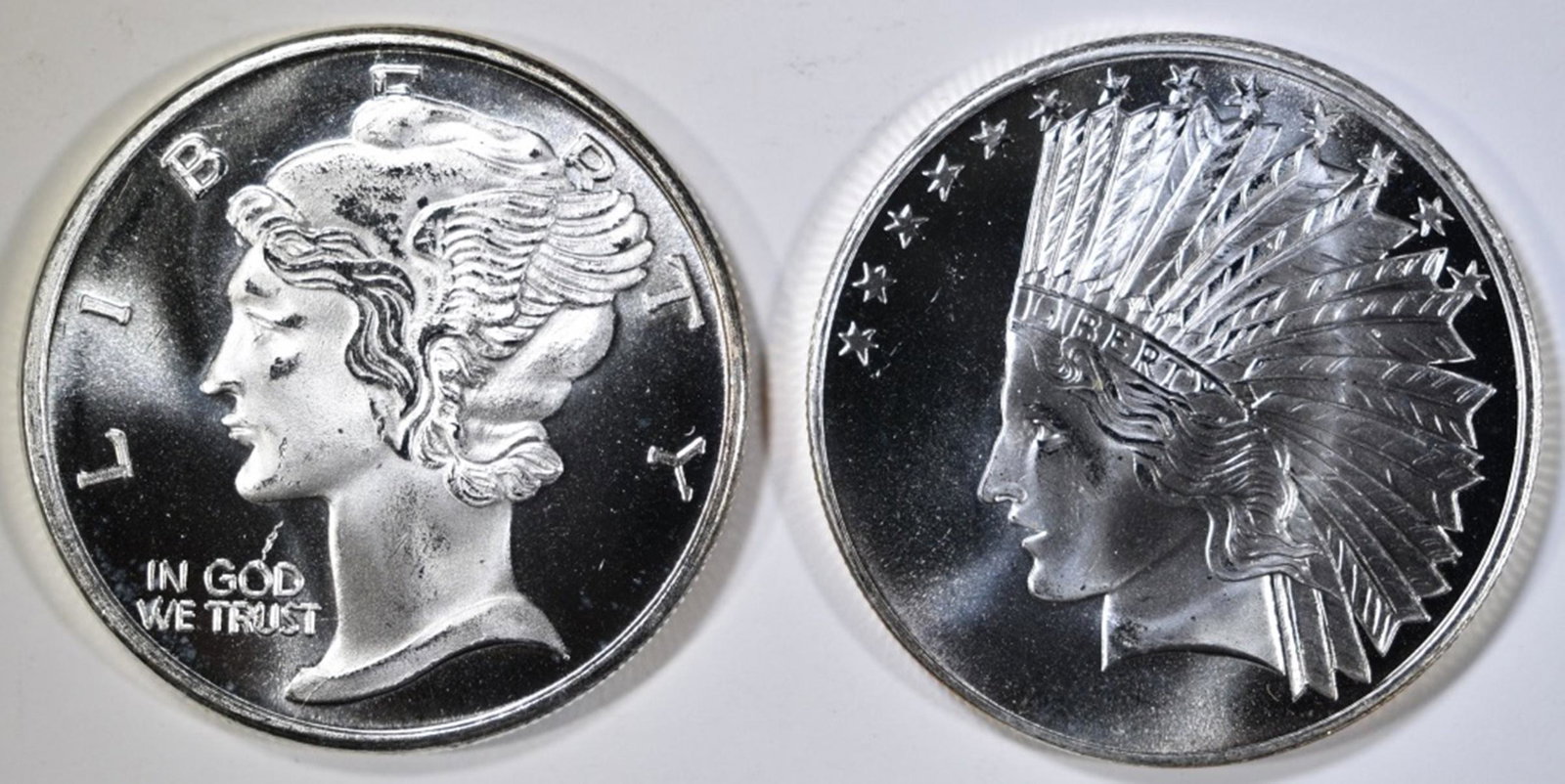 2 1OZ SILVER ROUNDS: BID WITH SILVER CITY AUCTIONS ESTIMATE $70 - $80.