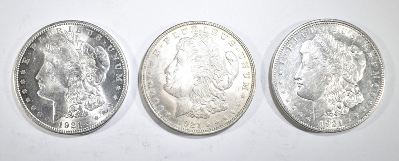3-NICE CIRC 1921 MORGAN DOLLARS: BID WITH SILVER CITY AUCTIONS ESTIMATE $125 - $150.