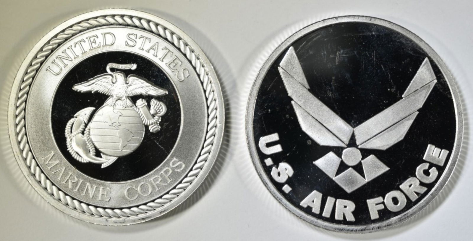 AIR FORCE & MARINES ONE OUNCE .999 SILVER ROUNDS: LEADERS IN ON-LINE AUCTIONS ESTIMATE $85 - $100.