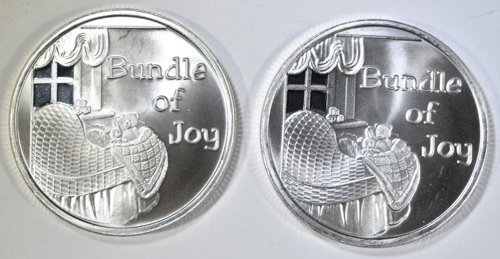 2-1oZ .999 SILVER ROUNDS "BUNDLE OF JOY": BID WITH SILVER CITY AUCTIONS ESTIMATE $85 - $95.