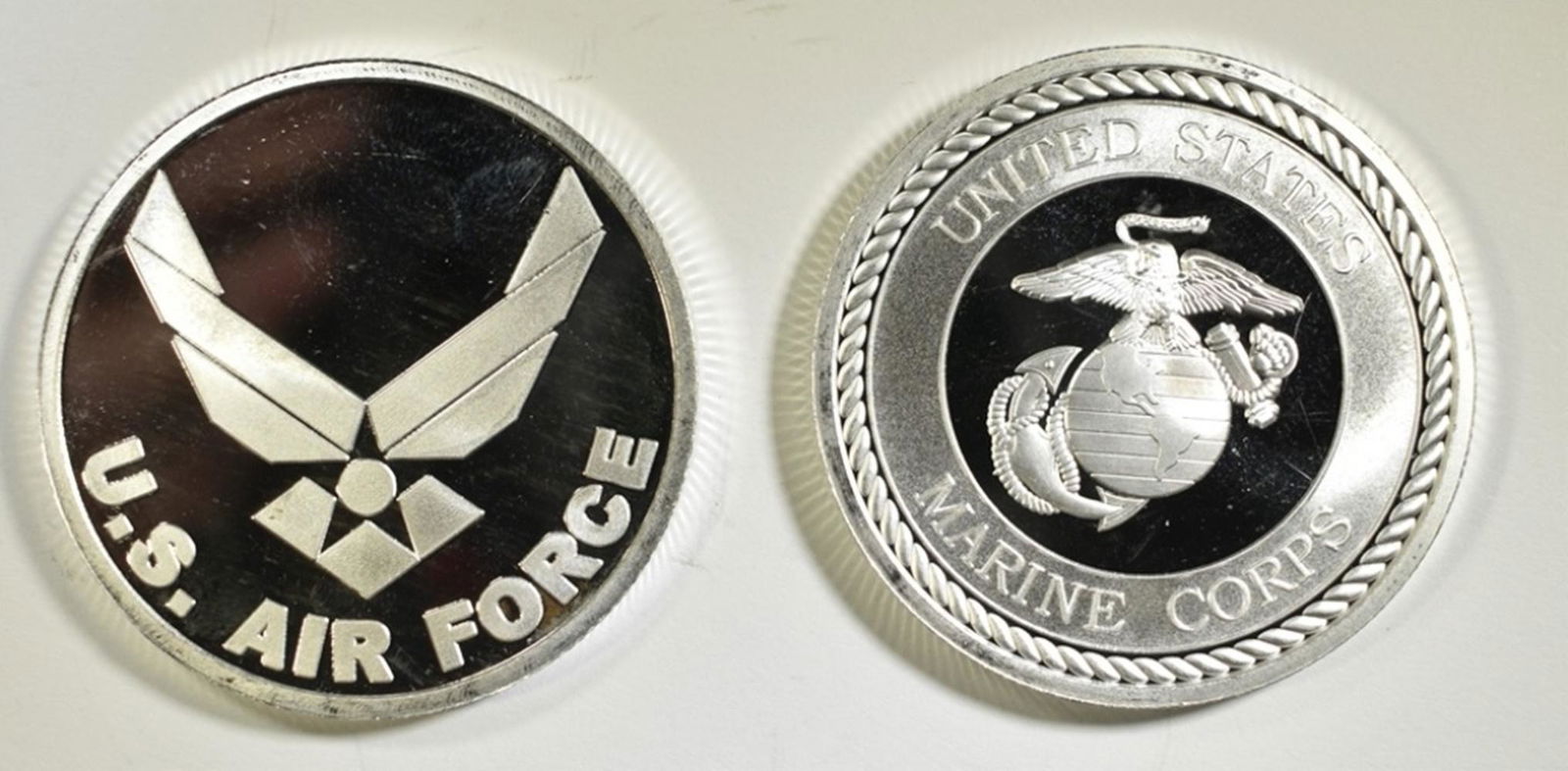 AIR FORCE & MARINES ONE OUNCE .999 SILVER ROUNDS: BID WITH SILVER CITY AUCTIONS ESTIMATE $85 - $100.