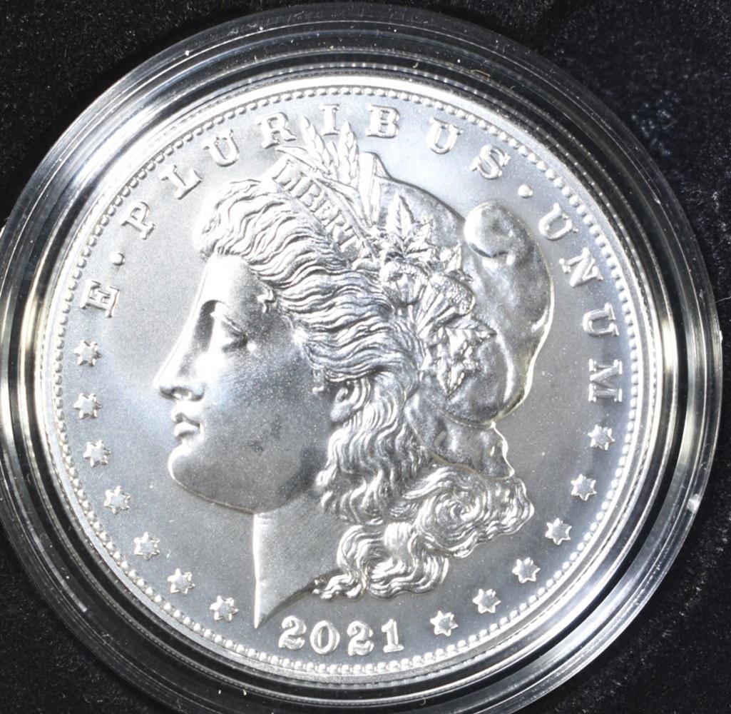 2021-S MORGAN DOLLAR IN OGP W/COA: LEADERS IN ONLINE AUCTIONS. ESTIMATE $125 - $150.