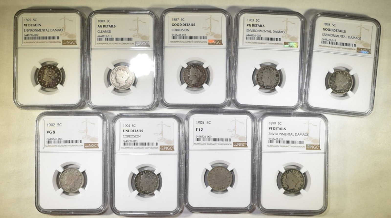 LOT OF 9 NGC GRADED LIBERTY NICKELS:: 1887 GOOD DETAILS - CORROSION, 1889 AU DETAILS - CLEANED, 1895 VF DETAILS - ENVIRON. DAMAGE, 1898 GOOD DETAILS - ENVIRON. DAMAGE, 1899 VF DETAILS - ENVIRON. DAMAGE, 1902 VG-8, 1903 VF DETAILS - ENVIRO