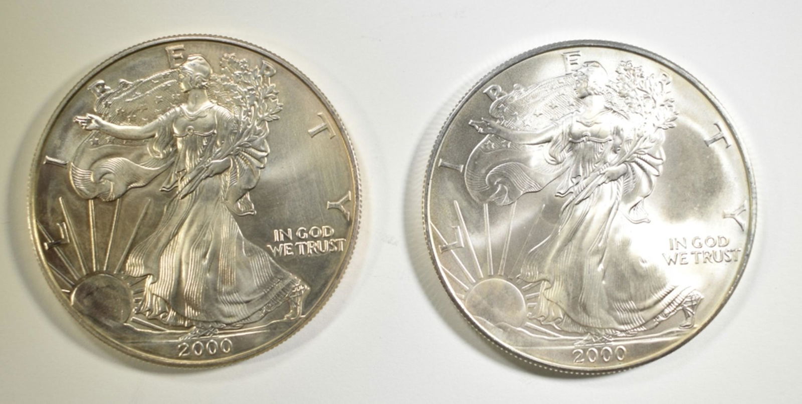 2-2000 BU AMERICAN SILVER EAGLES: BID WITH SILVER CITY AUCTIONS ESTIMATE $100 - $120.