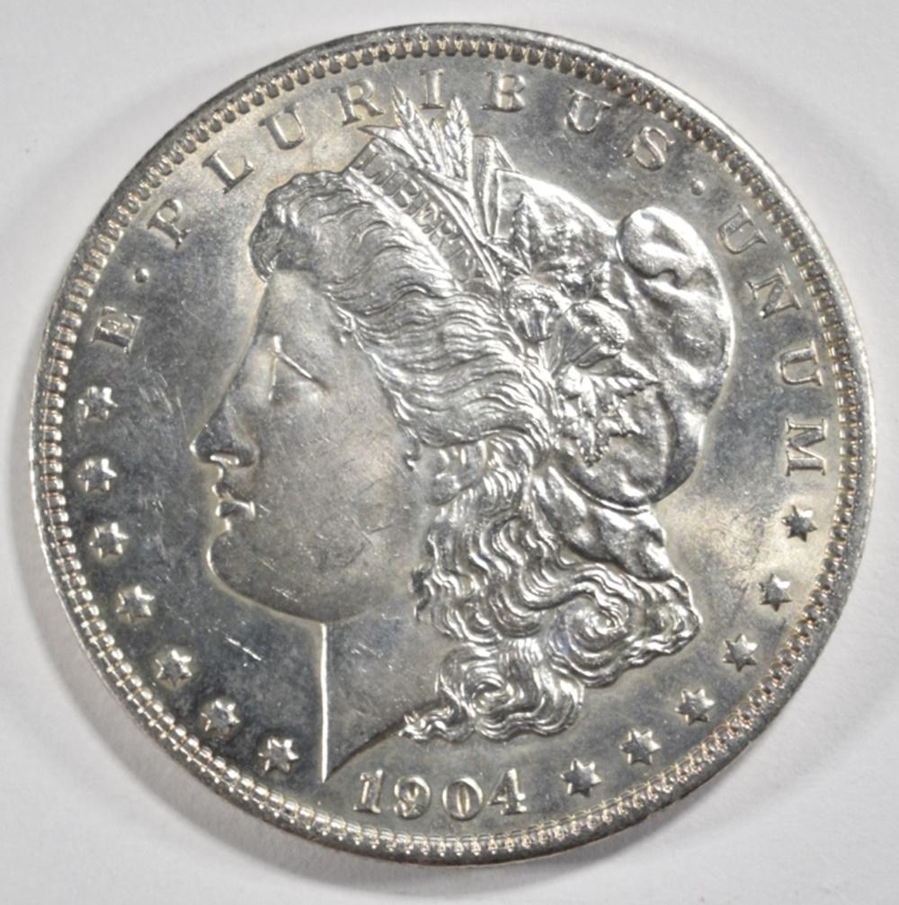 1904-O MORGAN DOLLAR CH BU: BID WITH SILVER CITY AUCTIONS. ESTIMATE $75 - $100.