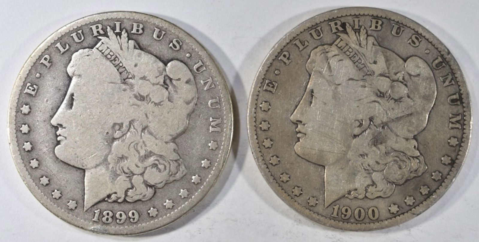 1899-O, 1900-O MORGAN DOLLARS GOOD: CHECK OUT OUR UPCOMING AUCTIONS ESTIMATE $80 - $120.