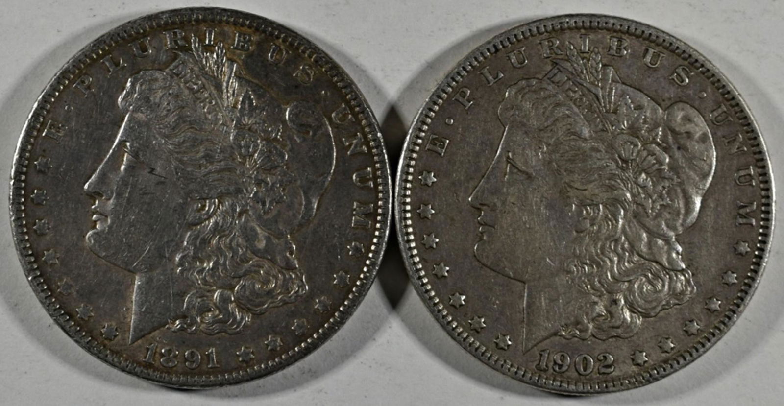 1891,1902 MORGAN DOLLARS XF/AU: LEADERS IN ON-LINE AUCTIONS ESTIMATE $100 - $150.