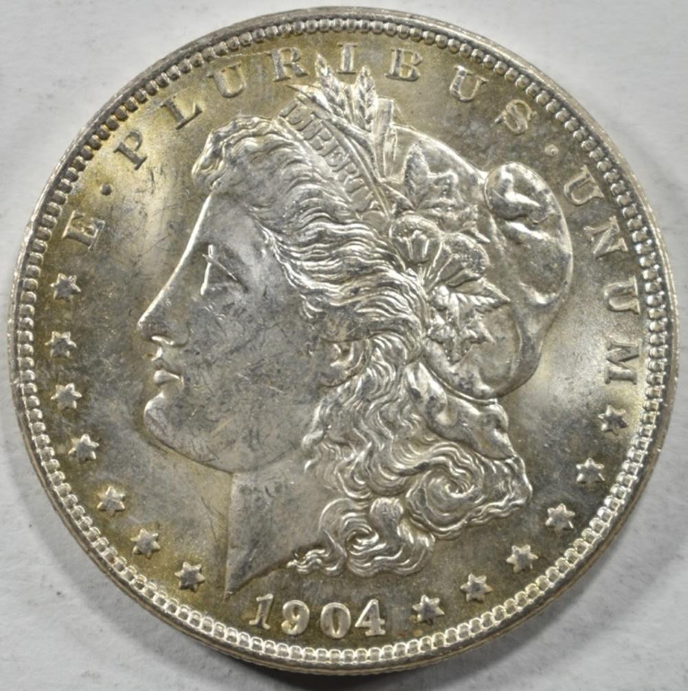 1904-O MORGAN DOLLAR CH BU: BID WITH SILVER CITY AUCTIONS ESTIMATE $75 - $100.