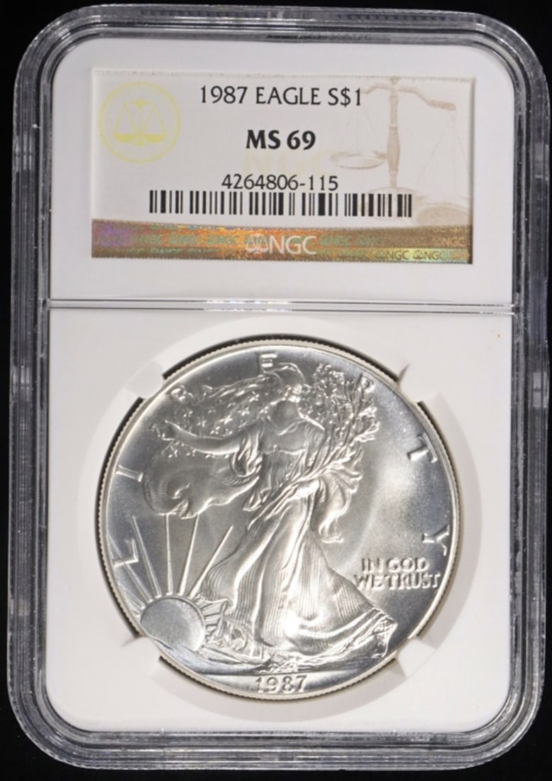 1987 AMERICAN SILVER EAGLE NGC MS69: TOP RATED AUCTION HOUSE ESTIMATE $80 - $120.