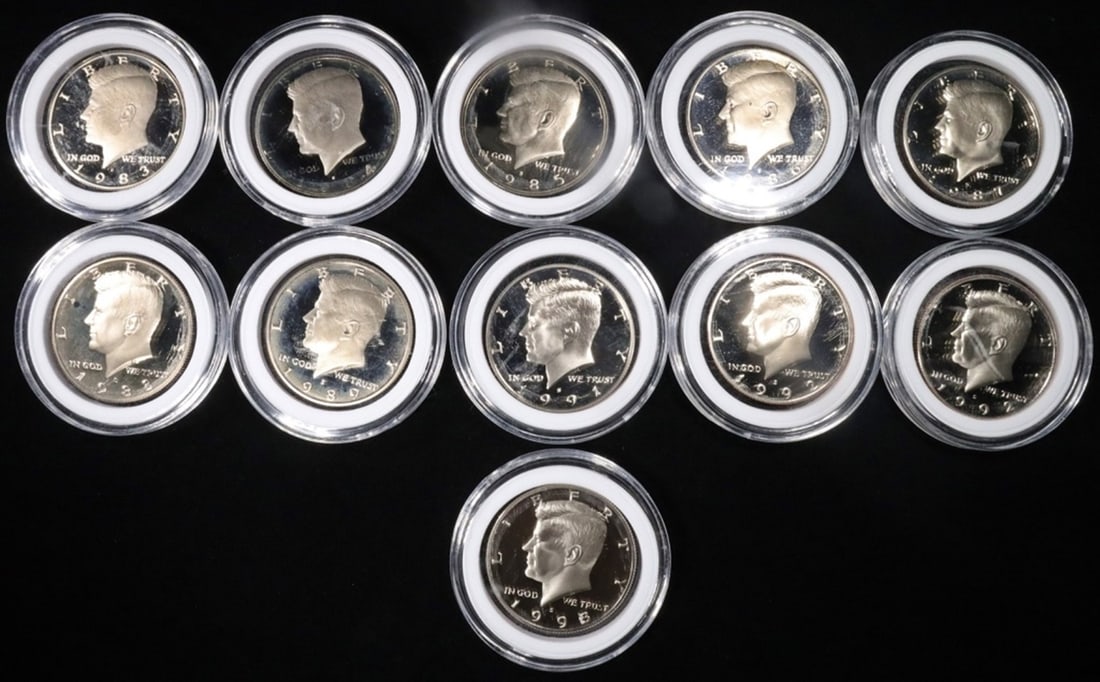 (11) S-MINT PROOF DCAM KENNEDY HALVES: 1983-1989, 1991, (2) 1992, 1993 ESTIMATE $120 - $170.