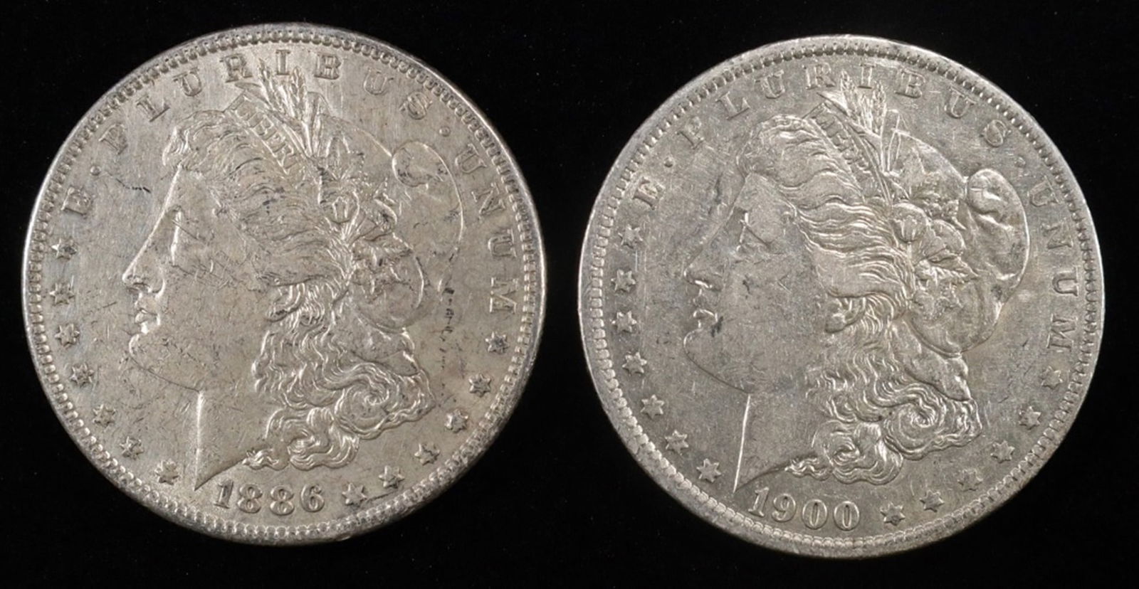 1886 (XF/AU) & 1900-O (XF) MORGAN DOLLARS: BID WITH SILVER CITY AUCTIONS ESTIMATE $80 - $120.