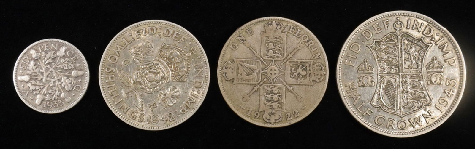 (4) GREAT BRITAIN SILVER COINS: 1933 6 PENCE, 1922 FLORIN, 1942 2 SHILLINGS, 1943 HALF CROWN ESTIMATE $60 - $80.