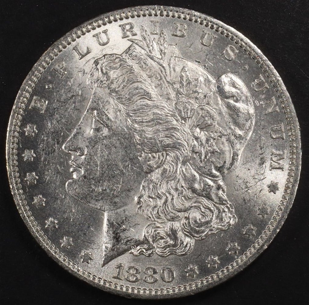 1880-O MORGAN DOLLAR BU: CHECK OUT OUR UPCOMING AUCTIONS ESTIMATE $160 - $200.