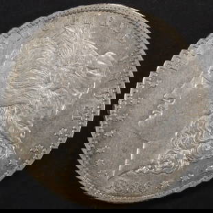 1886-O MORGAN DOLLAR AU/BU: CHECK OUT OUR UPCOMING AUCTIONS ESTIMATE $400 - $500.