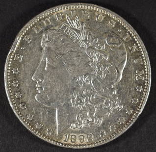 1892 MORGAN DOLLAR AU RIM BUMP: ESTIMATE $120 - $150.