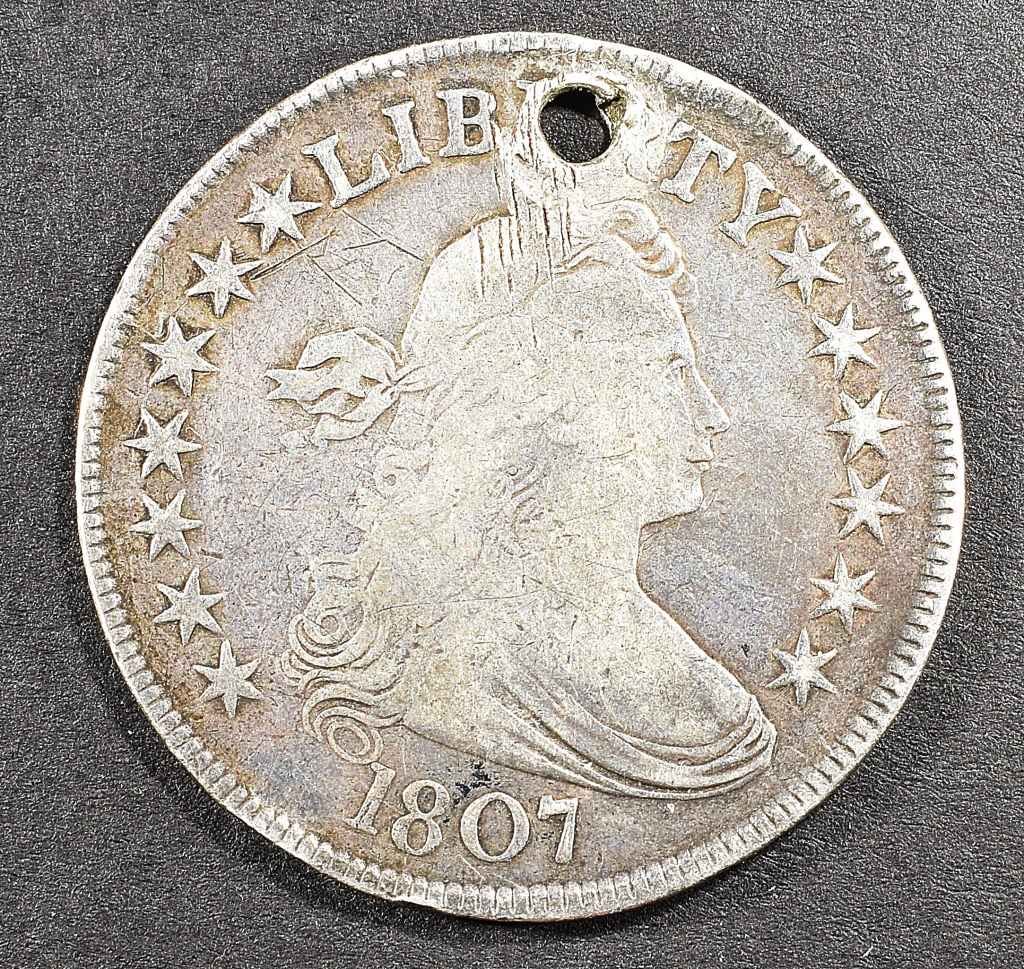 1807 BUST HALF DOLLAR HOLED: CHECK OUT OUR UPCOMING AUCTIONS ESTIMATE $200 - $250.