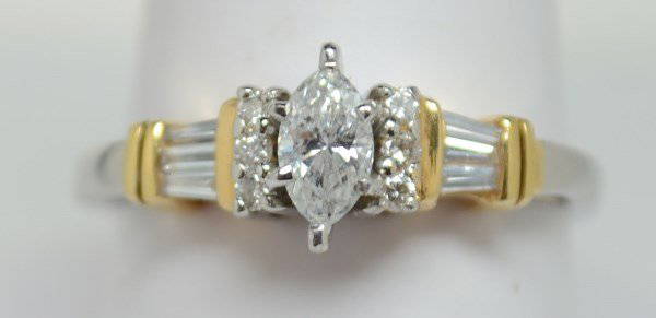 Gorgeous two-toned diamond ring..35ct. Size 8.5.: Two-toned diamond ring. 3.7 dwt. I1 clarity and I color. Center stone is .35ct. .63 tdw. Est Value: $1300-$1500