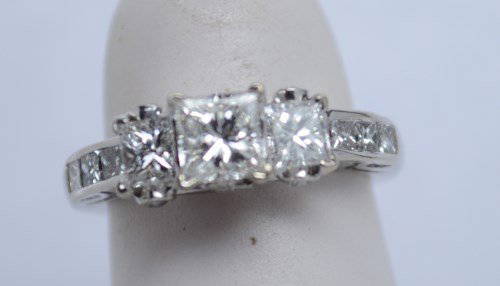 14kt 3 Stone Princess Cut Diamond Ring. Size 4. 1.25: It has 6 princess cut channel set accent diamonds. Size 4. 1.25 CTW. SI approx. E Color. 2.4 DTW. Est $2500-$3000