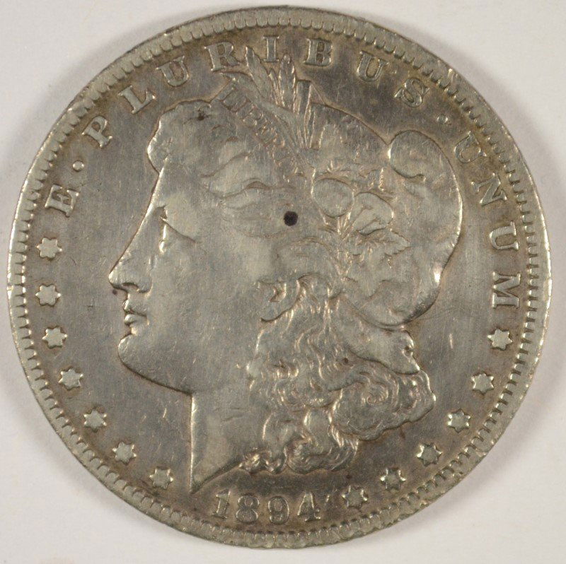 1894-O MORGAN DOLLAR GOOD: ESTIMATE $50 - $60. SILVERTOWNE AUCTIONS IS KNOWN FOR QUALITY & SERVICE. REGISTER TO BID!