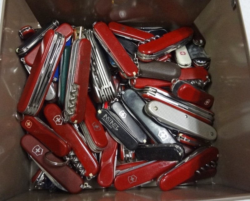 Metal Box of Victorinox Swiss Army Knives. New and: Metal Box of Victorinox Swiss Army Knives. Various sizes, styles, designs and tools/functions. ESTIMATE:$175-$200