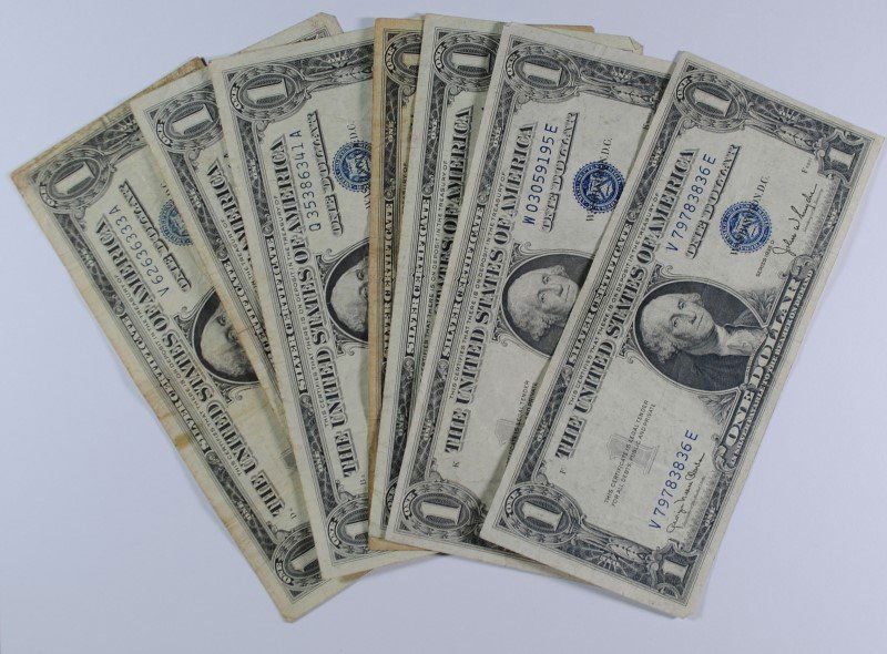 7 - $1 SILVER CERTIFICATES; 2-1935D, 2-1957B, 2-1957A,: Bid with confidence at Silver Towne Auctions. ESTIMATE $20-$25