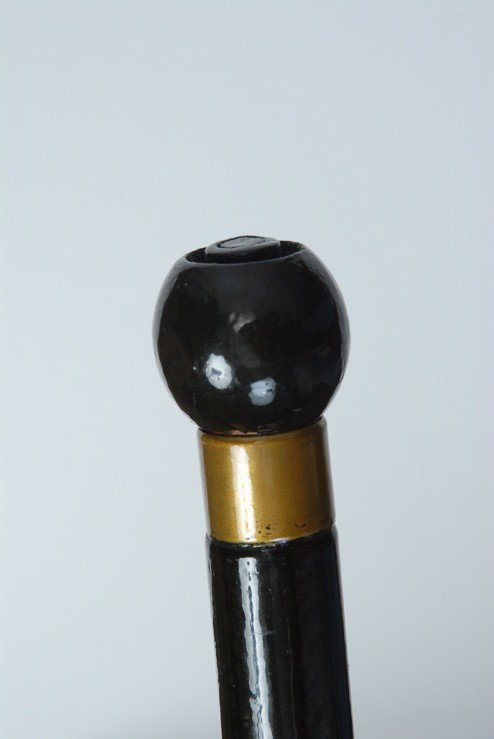 A very nice 45 star American flag cane: A very nice 45 star American flag cane. The round conifer wood handle is 1 2/3" in diameter and painted black. A straight pull allows cotton American flag that is wrapped around a thin hardwood pole a