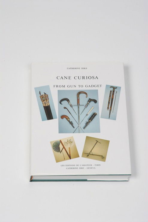 A hardbound "Cane Curiosa, From Gun to Gadget": A hardbound copy of Cane Curiosa, From Gun to Gadget, by Catherine Dike. Long considered to be the very best resource for gadget or system canes, it is now out of print and is becoming more and more s