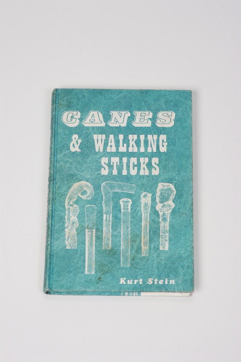 A hardbound "Canes and Walking Sticks": A hardbound copy of Canes and Walking Sticks by Kurt Stein. This scarce volume was written in 1974 and is generally accepted as the definitive book on the dating of canes. It is out of print and diffi