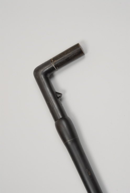 A very nice French 20mm cartridge gun cane curio: A very nice French 20mm cartridge gun cane curio. The "L" horn and gunmetal handle is 4" high and 3 3/4" to the side. The all-metal shaft opens by unscrewing so that a large 20mm shell can be loaded. 