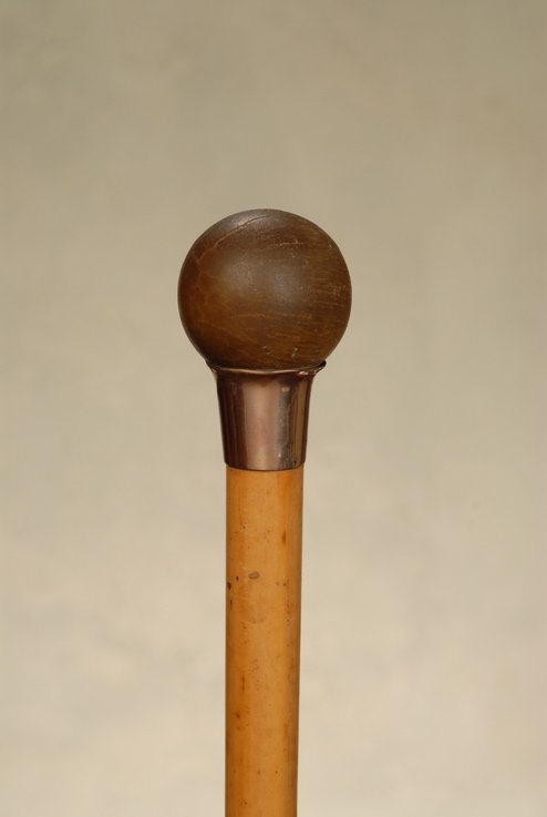 A most unusual rhino horn ball and pink gold cane: A most unusual rhino horn ball and pink gold cane. The rhino horn ball handle is 1 3/4" in diameter and it sits atop a 1" gold cup/collar that is London hallmarked for 9k. The ball has a dulled finish